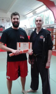 Craig Bendon gaining his orange belt in Jun Fan