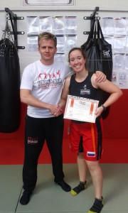 Marina Martin Arias gaining her orange belt in Jun Fan